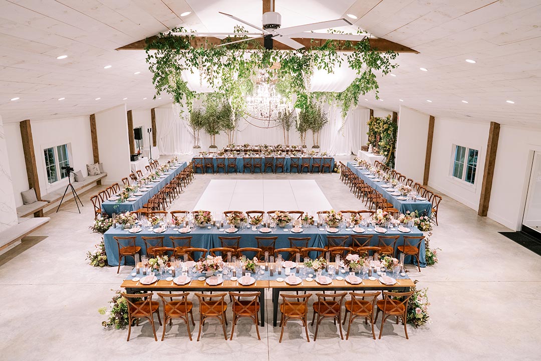 An overhead view of a large wedding reception venue in Northern Virginia with tables set for a wedding party.