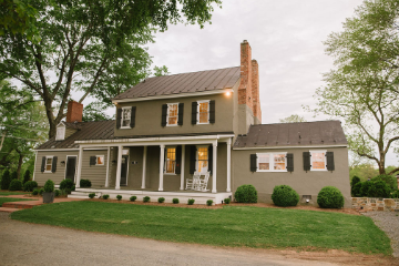 An exterior view of a historic manor house that is highlighted in Fleetwood Farm Winery's historic winery tours.